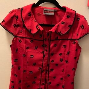Jawbreaker red and black cap sleeve blouse.